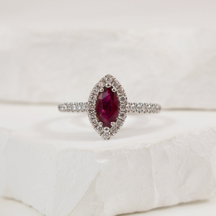 18KW Marquise Cut Ruby & Diamond Halo Ring        

18K White Gold Marquise Cut Ruby & Natural Diamond Halo Ring

0.55 Carat Marquise Cut Ruby

0.29 Total Natural Diamond Weight of SI1-2 Clarity, GH Colour

Finger Size 6.5