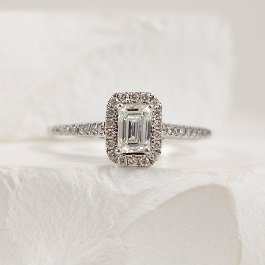 14KW Emerald Cut Diamond Halo Engagement Ring     

14K White Gold Natural Diamond Halo Engagement Ring

Center - 0.50 Carat Emerald Cut Diamond I1 Clarity, H Colour

Accent - 0.25 Carats Natural Diamonds of I1 Clarity, H Colour 

0.75 Total 