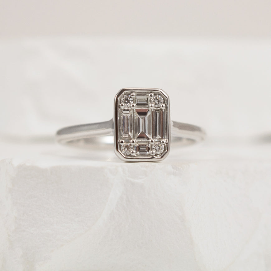 14KW Lovebright Illusion Diamond Engagement Ring  

14K White Gold Lovebright Illusion 'Solitaire Emerald Cut' Diamond Engagement Ring 

Diamonds - 0.36 (1.00CT Look) Total Natural Diamond Weight of SI1-2 Clarity, GH Colour 

Baguette & Round B
