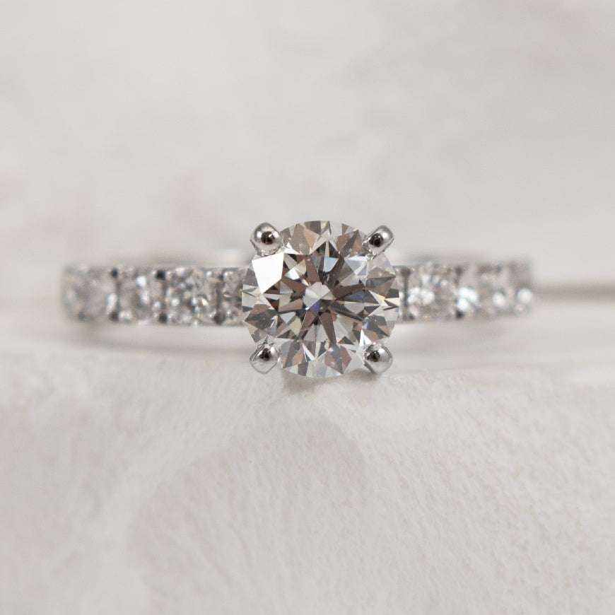 Platinum Roman & Jules Natural Diamond Accented Engagement Ring 

Center Diamond - 1.02 Carat Round Brilliant Cut Natural Diamond of SI1 Clarity, G Colour, Very Good Cut, GIA Certified 

Accent Diamonds - 0.59 Carats Round Brilliant Cut Natural D