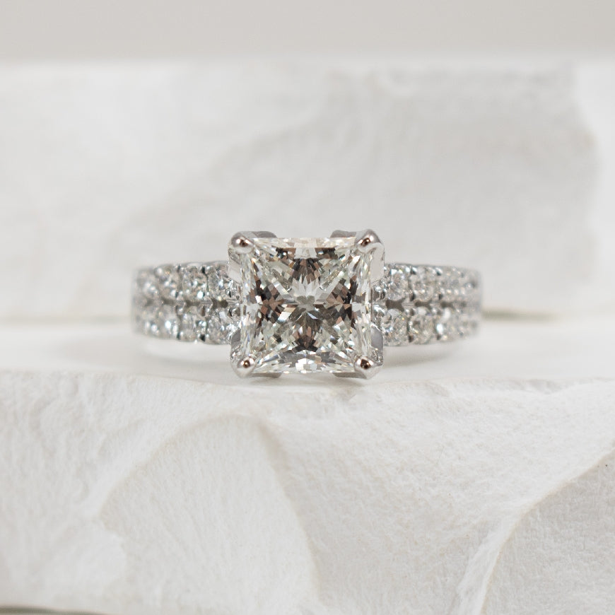 14KW 2.01CT Princess Cut Diamond Engagement Ring  

14K White Gold Princess Cut Lab Grown & Natural Diamond Engagement Ring  
         
Center - 2.01 Carat Princess Cut Lab Grown Diamond of VS1 Clarity, E Colour, Excellent/ Excellent Cut, IGI Cer