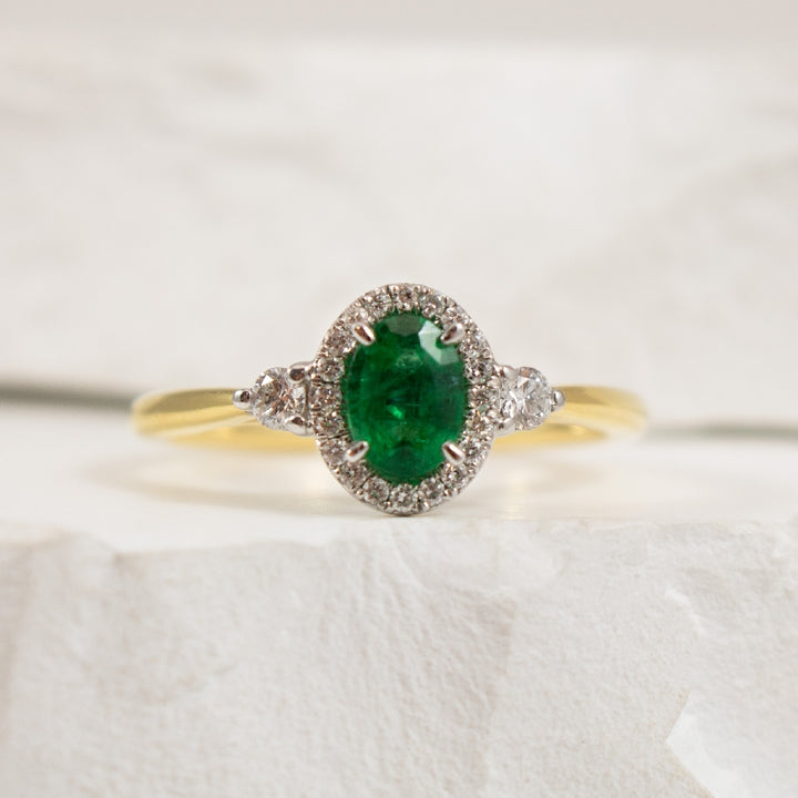 18KYW Emerald & Canadian Diamond Halo Ring        

18K Yellow & White Gold Emerald & Canadian Diamond Halo Ring 

0.21 Total Natural Diamond Weight 

Finger Size 6.5

