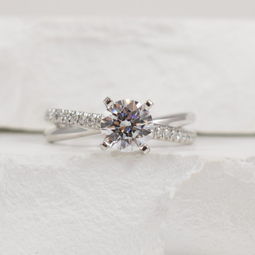 14KW Diamond Twist Accented Ring Setting           

14K White Gold Gabriel & Co Diamond Accented Ring Setting

Center - To Hold 1.00 Carat Round Brilliant Cut Diamond

Accent - 0.19 Carats Natural Diamonds of SI2+ Clarity, GH Colour

Band Wi