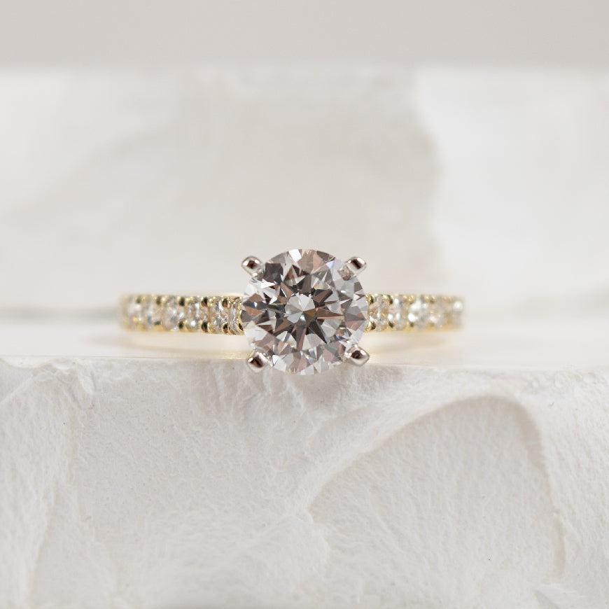 14KY Gabriel & Co. Diamond Engagement Ring 

14K Yellow Gold Gabriel & Co. Lab Grown & Natural Diamond Accented Engagement Ring 

Center - 1.12 Carat Round Brilliant Cut Diamond of VS1 Clarity, E Colour, Excellent/ Excellent/ Excellent Cut, IGI C