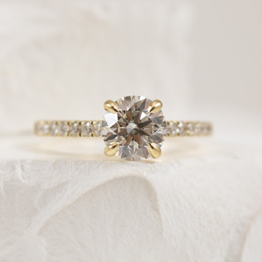 14K Yellow Gold S.Kashi Forevermark Natural Diamond Accented Engagement Ring

Center - 1.21 Carat Round Brilliant Cut Forevermark Natural Diamond of VS2 Clarity, I Colour, Black Label (Ideal) Cut, Forevermark Certified 
 
Accent - 0.28 Carats Rou