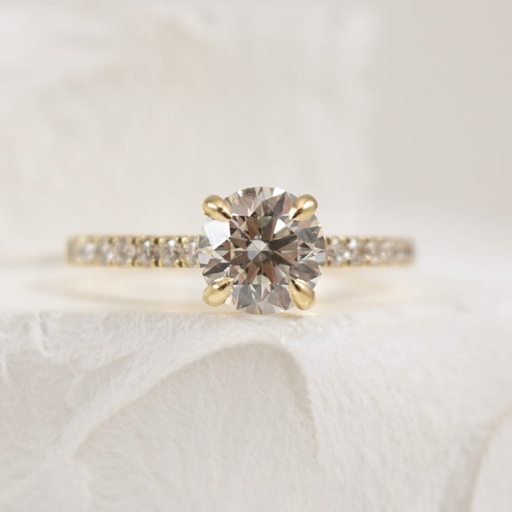14K Yellow Gold S.Kashi Forevermark Natural Diamond Accented Engagement Ring

Center - 1.21 Carat Round Brilliant Cut Forevermark Natural Diamond of VS2 Clarity, I Colour, Black Label (Ideal) Cut, Forevermark Certified 
 
Accent - 0.28 Carats Rou