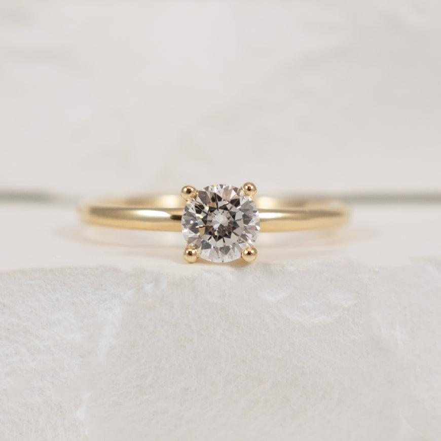 14KY Canadian Diamond Solitaire Engagement Ring   

14K Yellow Gold Arctic Circle Canadian Diamond Solitaire Engagement Ring

Center - 0.51 Carat Round Brilliant Cut Natural Diamond of I1 Clarity, G-H Colour, Very Good Cut

Band Width 1.8mm

