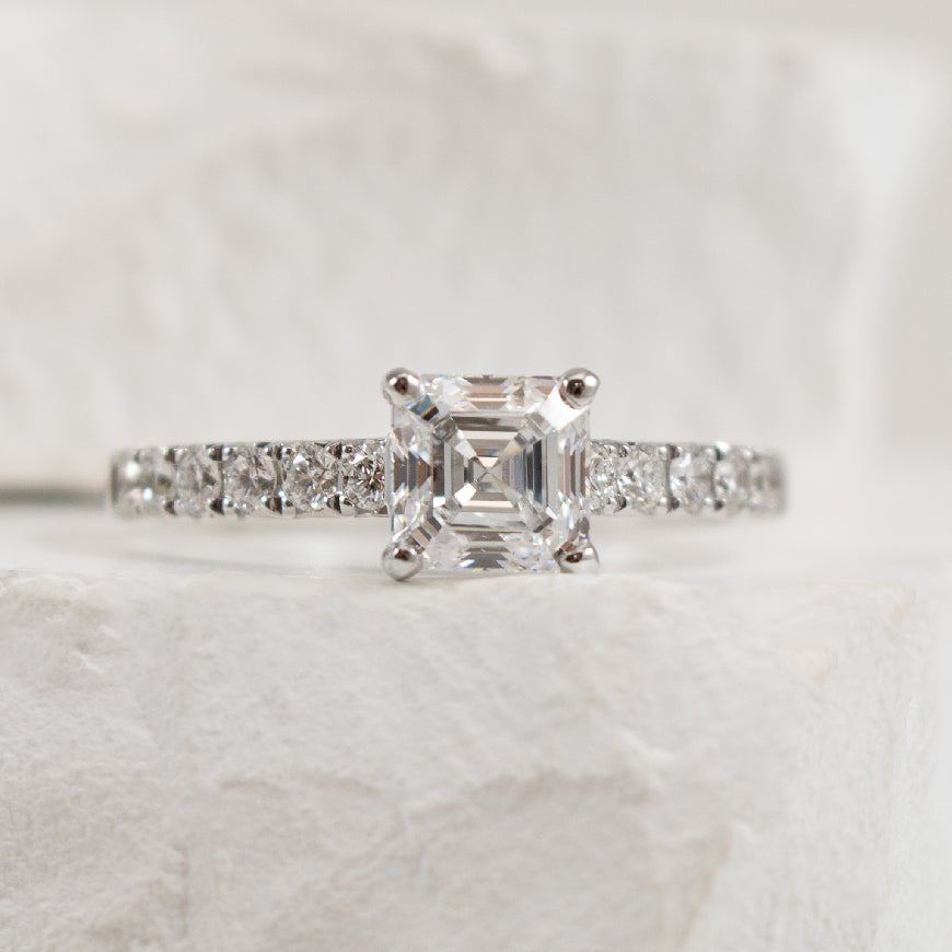 14KY 1.05CT Asscher Cut Diamond Engagement Ring   

14K White Gold Roman & Jules Natural Diamond Asscher Cut Accented Engagement Ring 

Center - 1.05 Carat Asscher Cut Lab Grown Diamond of VS1 Clarity, D Colour, Very Good/ Very Good Cut, IGI Cert