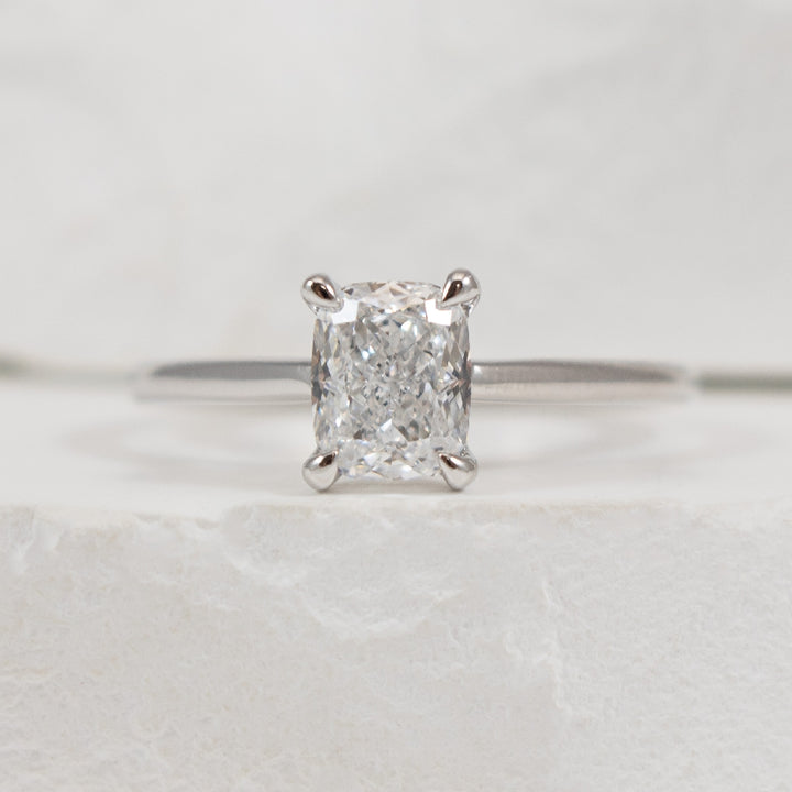 14KW Elongated Cushion Diamond Engagement Ring    

14K White Gold Lab Grown Diamond Elongated Cushion Cut Solitaire Engagement Ring  

Center - 1.01 Carat Elongated Cushion Cut Lab Grown Diamond of VVS2 Clarity, D Colour, Very Good Cut  

Fing