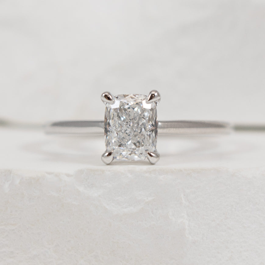 14KW Elongated Cushion Diamond Engagement Ring    

14K White Gold Lab Grown Diamond Elongated Cushion Cut Solitaire Engagement Ring  

Center - 1.01 Carat Elongated Cushion Cut Lab Grown Diamond of VVS2 Clarity, D Colour, Very Good Cut  

Band