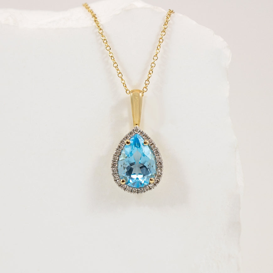 10KY Pear Shape Blue Topaz & Diamond Halo Necklace 

10K Yellow Gold Blue Topaz & Natural Diamond Necklace

0.135 Total Natural Diamond Weight

Chain Length  '
