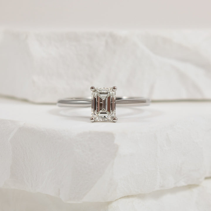 14KW Emerald Cut 1.05CT Diamond Engagement Ring  

14K White Gold Natural Diamond Emerald Cut Solitaire Engagement Ring 

Center Diamond - 1.05 Carat Emerald Cut Natural Diamond of 
SI1 Clarity, G Colour, Very Good/ Very Good Cut, GIA Certified 