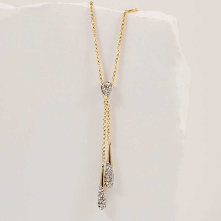 14KY Double Lariat Diamond Necklace                      

14K Yellow Gold Natural Diamond Necklace

0.33 Total Natural Diamond Weight SI Clarity, GH Colour

Chain Length 18' (Adjustable to 16')

 