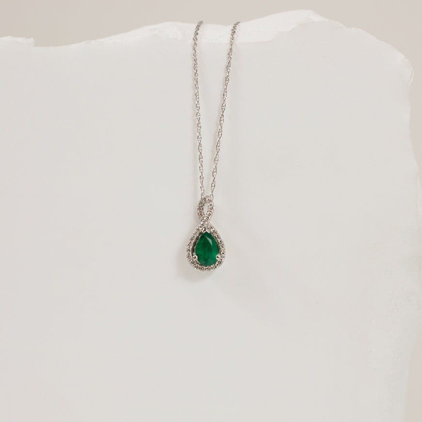 14KW Pear Shaped Emerald & Diamond Halo Necklace   

14K White Gold Emerald & Natural Diamond Halo Necklace

6X4 Pear Shaped Emerald
0.10 Total Natural Diamond Weight SI1 Clarity, GH Colour

Chain Length 18'


