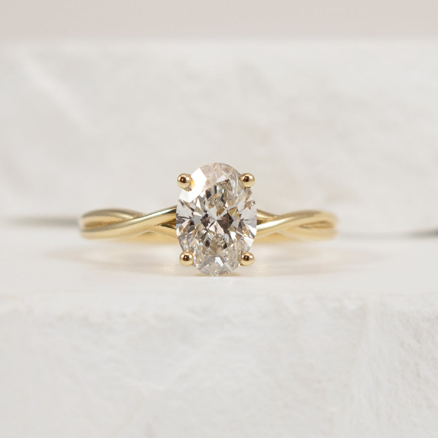 14KY Twist Oval Cut Diamond Engagement Ring      

14K Yellow Gold Lab Grown Twist Diamond Solitaire Engagement Ring 

Center - 1.11CT Oval Cut Lab Grown Diamond of VS2 Clarity, G Colour, Very Good Cut 

Band Width 2mm

Finger Size 6.5 

