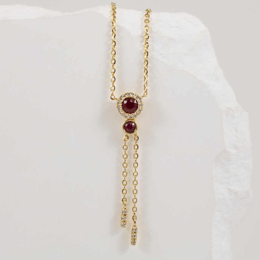 14KY Ruby & Diamond Fancy Drop Necklace         

14K Yellow Gold Roman & Jules Ruby & Natural Diamond Necklace

0.20 Total Ruby Weight 

0.06 Total Natural Diamond Weight SI1-2 Clarity, GH Colour

Chain Length 18' (Adjustable to 16' or 17')
