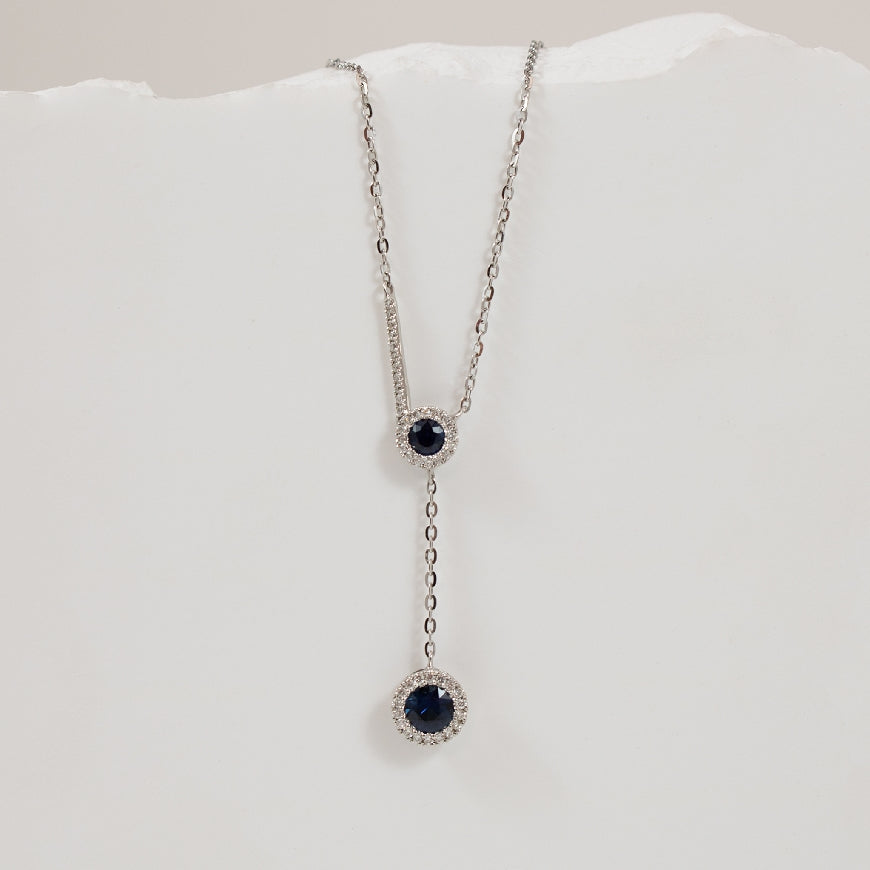 14KW Sapphire & Diamond Halo Lariat Drop Necklace 

14K White Gold Roman & Jules Sapphire & Natural Diamond Necklace

0.45 Total Sapphire Weight

0.12 Total Natural Diamond Wight SI Clairty, GH Colour

Chain Length 18' (Adjustable to 16' or 1