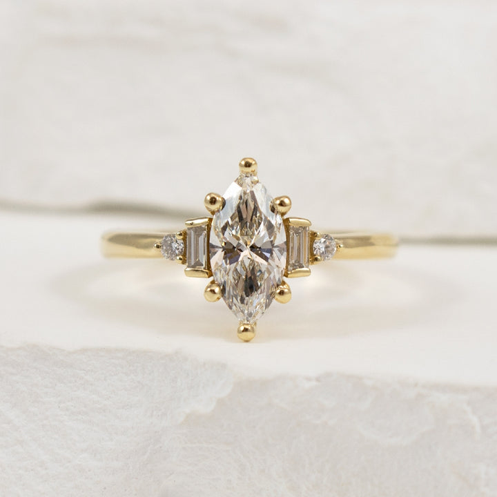 14KY Marquise Cut Diamond Engagement Ring         

14K Yellow Gold Marquise Cut Lab Grown Diamond Accented Engagement Ring 

Center - 1.01 Carat Marquise Cut Lab Grown Diamond of VS1 Clarity, F Colour, Excellent/ Excellent Cut, IGI Certified 
