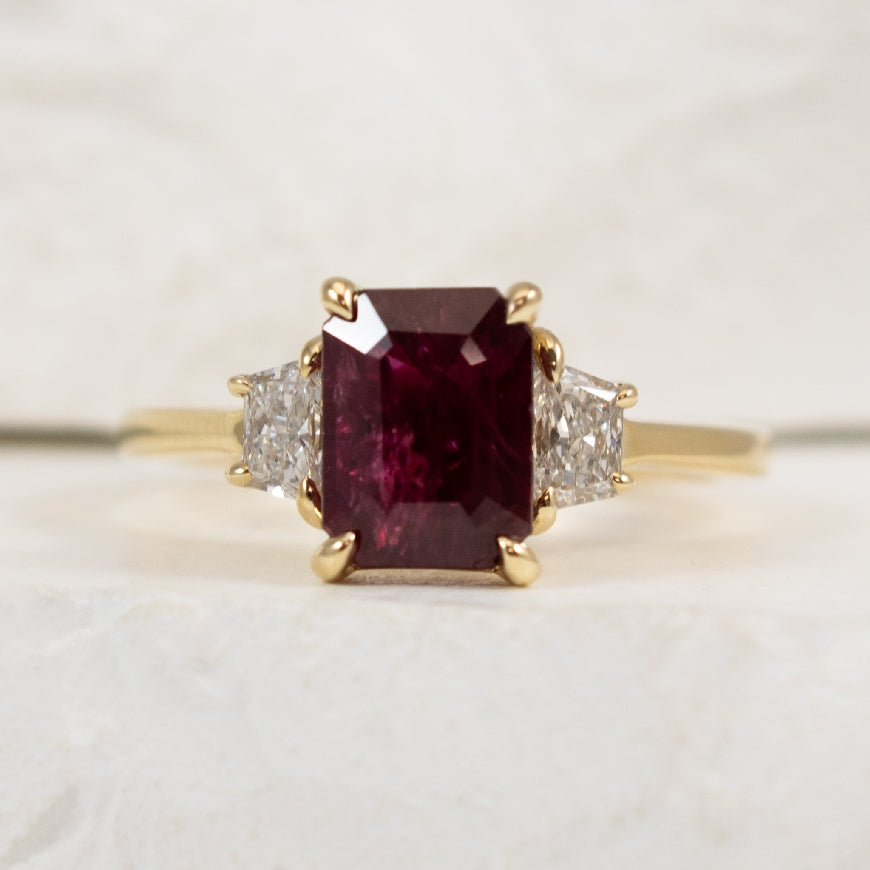 14KY Radiant & Trapezoid Diamond & Ruby Ring  

14K Yellow Gold Radiant & Trapezoid Cut Three Stone Ruby & Lab Grown Diamond Ring

1.77 Carat Radiant Cut Ruby AA Quality 

0.44 Carats Trapezoid Cut Lab Grown Diamonds of VS1 Clarity, E Colour, V