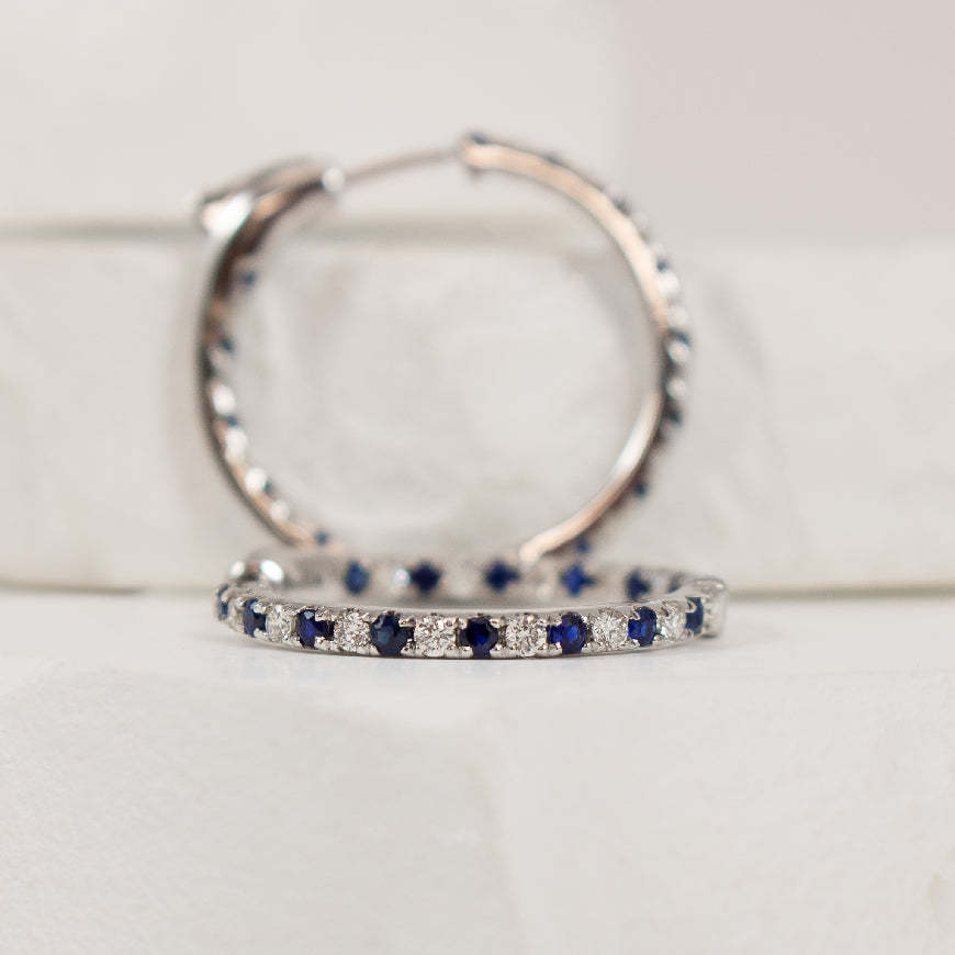 14KW Inside-Out Sapphire & Diamond Hoop Earrings  

14K White Gold Roman & Jules Natural Diamond & Sapphire Inside-Out Hoop Earrings 

0.72 Total Sapphire Weight

0.45 Total Natural Diamond Weight SI1-2 Clarity, G-H Colour 

0.75' Diameter 
