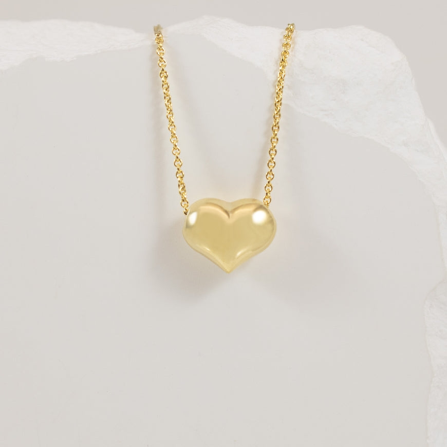 14KY Modern Puffed Heart Necklace                      

14K Yellow Gold Puffed Heart Necklace 

Chain Length 18' (Adjustable)

2.11 Grams 