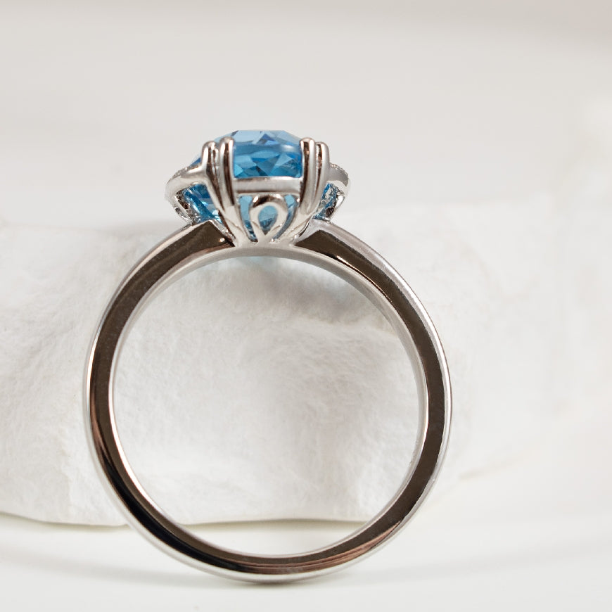 14KW Blue Topaz & Diamond Halo Ring