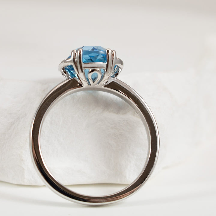 14KW Blue Topaz & Diamond Halo Ring