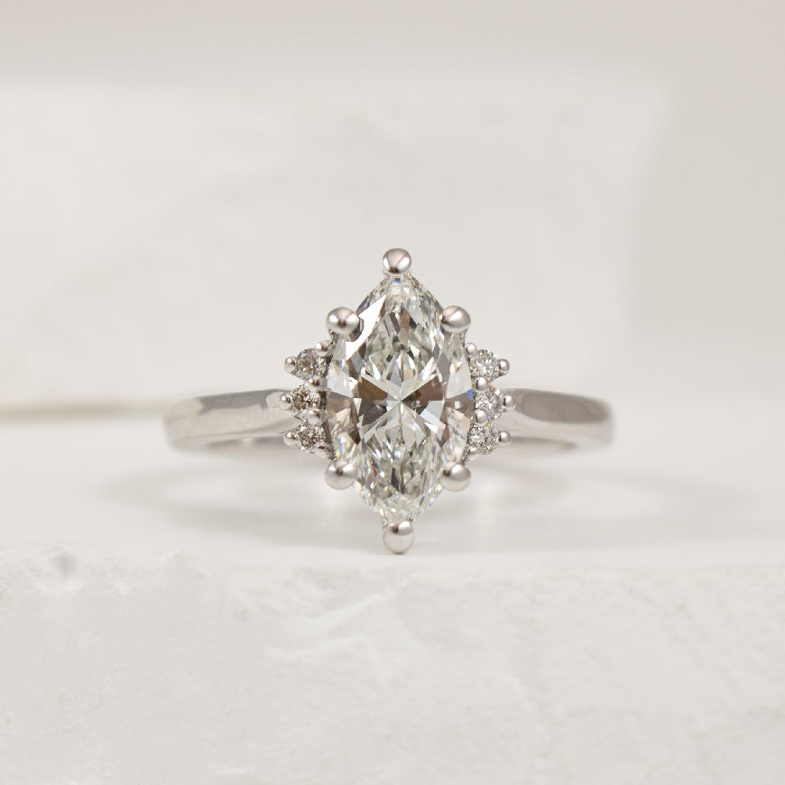 14KW 1.44CT Marquise Cut Diamond Engagement Ring      

14K White Gold Marquise Cut Lab Grown & Natural Diamond Engagement Ring  

Center - 1.44CT Marquis Cut Lab Grown Diamond of VVS2 Clarity, E Colour, Excellent/ Excellent Cut 

Accent - 0.07