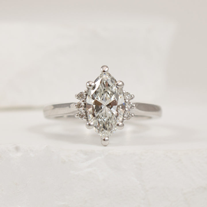 14KW 1.44CT Marquise Cut Diamond Engagement Ring      

14K White Gold Marquise Cut Lab Grown & Natural Diamond Engagement Ring  

Center - 1.44CT Marquis Cut Lab Grown Diamond of VVS2 Clarity, E Colour, Excellent/ Excellent Cut 

Accent - 0.07