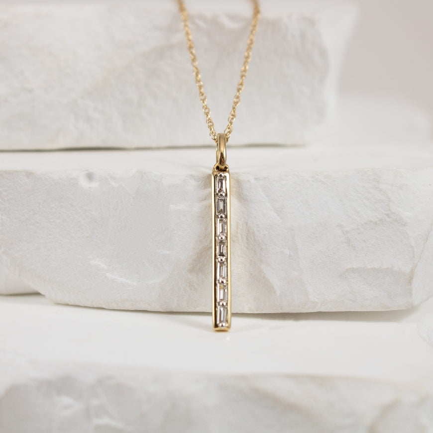 14KY Diamond Baguette Bar Necklace                

14K Yellow Gold Natural Diamond Baguette Bar Necklace

0.08 Total Natural Baguette Cut Diamond Weight SI Clarity, GH Colour

Chain Length 18'
