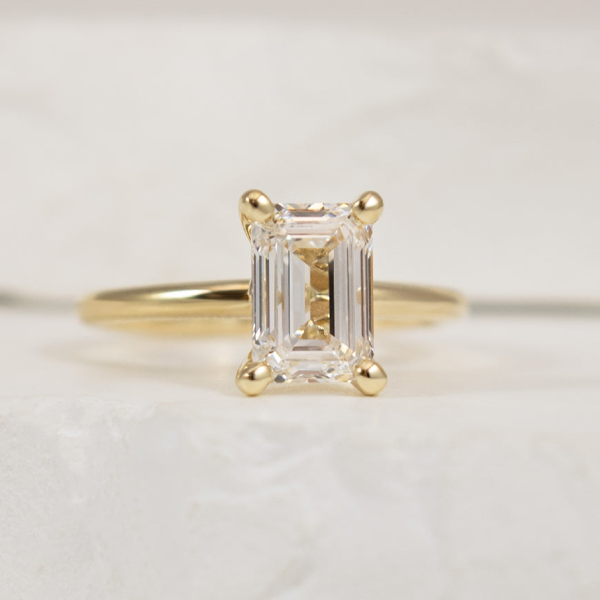 14KY 2.01CT Solitaire Diamond Engagement Ring          

14K Yellow Gold Gabriel & Co. Lab Grown Solitaire Diamond Engagement Ring  

Center - 2.01CT Emerald Cut Lab Grown Diamond of VVS2 Clarity, E Colour, Excellent/ Excellent Cut 

Band Width