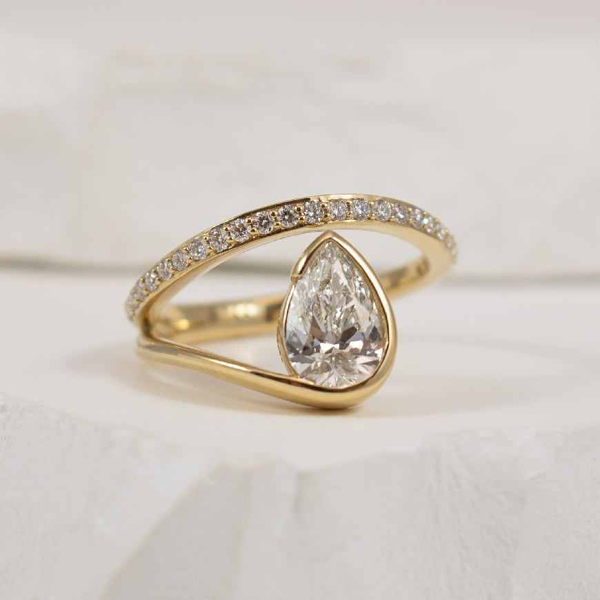 14KY Pear Shaped Abstract Diamond Engagement Ring 

14K Yellow Gold Pear Shaped Lab Grown Diamond Accented Engagement Ring 

1.04 Carat Pear Shaped Lab Grown Diamond of VS1 Clarity, F Colour, Excellent/ Excellent Cut, IGI Certified 

1.29 Total