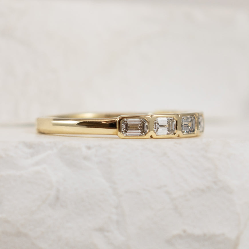 14KY Emerald Cut 0.70CT Bezel Set Band