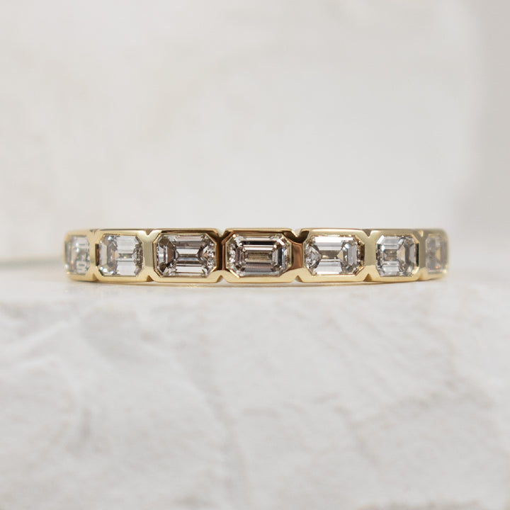 14KY Emerald Cut 0.70CT Bezel Set Band            

14K Yellow Gold Emerald Cut Bezel Set Band 

0.70 Carats Total Weight Emerald Cut Natural Diamonds of I1 Clarity, H-J Colour 

Finger Size 6.75 