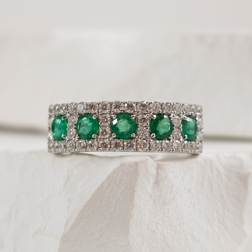 14KW Emerald & Diamond Five Stone Ring                      

14K White Gold Emerald & Diamond Five Stone Ring 

0.60 Carats of Emeralds

0.64 Carat Total Diamond Weight of SI1-2 Clarity, GH Colour 

6.5mm Wide 

Finger Size 6.5 