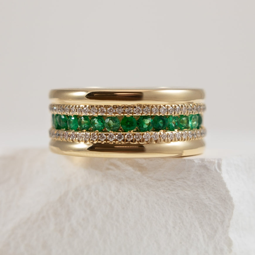 14KY Emerald & Diamond Wide Statement Ring                      

14K Yellow Gold Emerald & Diamond Wide Statement Ring 

0.56 Carats of Emeralds

0.27 Carat Total Diamond Weight of SI1-2 Clarity, GH Colour 

9.00mm Wide 

Finger Size 6.5 