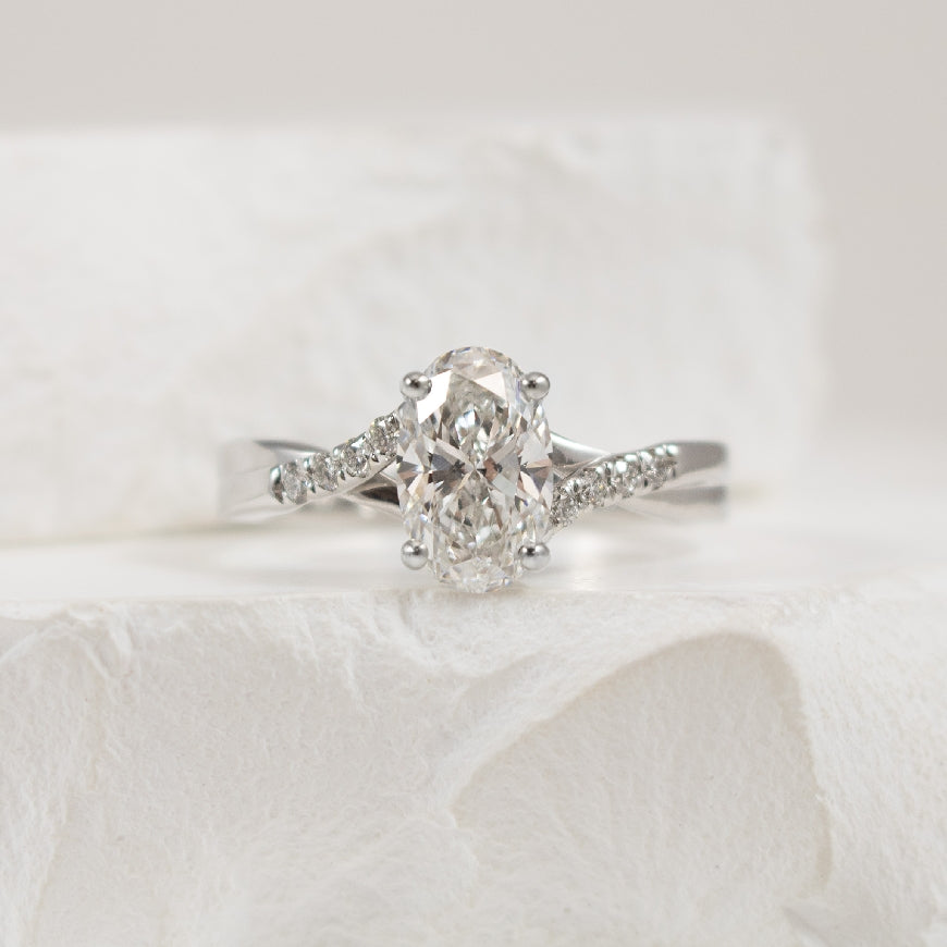 14KW S.Kashi Oval Twist Diamond Engagement Ring                

14K White Gold S.Kashi Oval Cut Lab Grown & Natural Diamond Twist Engagement Ring 

Center - 1.20 Carat Oval Cut Lab Grown Diamond of VS2 Clarity, F Colour, Very Good/Very Good Cut 