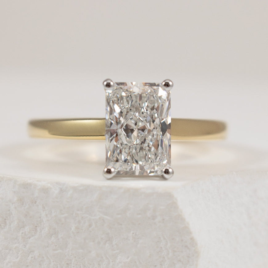 14KY S.Kashi Radiant Diamond Engagement Ring                      

14K Yellow Gold S.Kashi Radiant Cut Lab Grown & Natural Diamond Hidden Halo Engagement Ring 

1.80 Carat Radiant Cut Lab Grown Diamond of VVS2 Clarity, E Colour, Excellent/ Excel