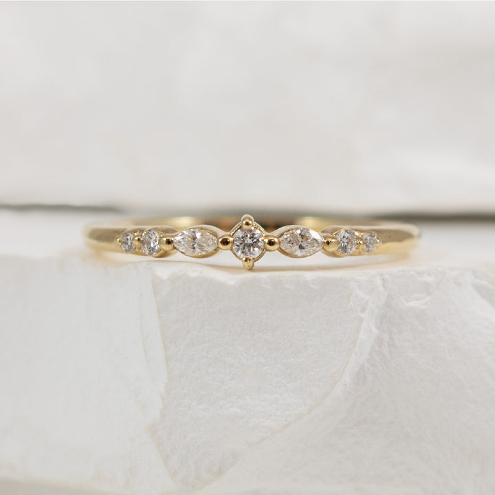 14KY 0.12CT Marquise & Round Cut Diamond Band     

14K Yellow Gold Natural Diamond Band 

0.12 Total Round Brilliant & Marquise Cut Natural Diamond Weight SI1-2 Clarity, G-H Colour 
 
Finger Size 6.75