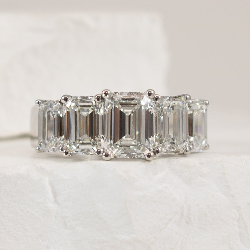 14KW 4.96CT Five Stone Emerald Cut Diamond Ring   

14K White Gold 5 Stone Emerald Cut Lab Grown Diamond Ring

1.54 Carat Emerald Cut Lab Grown Diamond of VVS2 Clarity, E Colour, XX

4.96 Carat Total Diamond Weight of VVS2-VS1 Clarity, E Colour