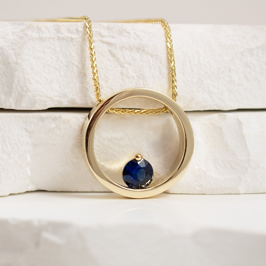 14KY Modern 'Floating' Circle Sapphire Necklace 

14K Yellow Gold 'Floating' Circle Natural Sapphire Necklace 

0.80 Carat Natural Blue AAA Sapphire 

20' Chain Length 