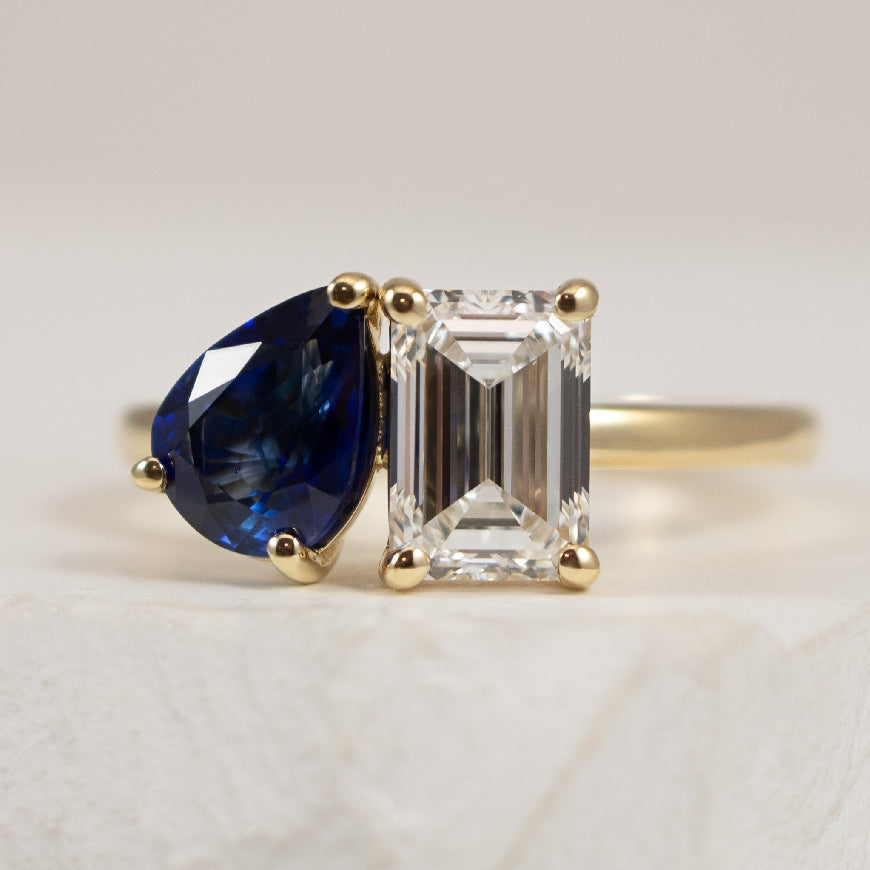 14KY Toi et Moi Sapphire & Diamond Ring        

14K Yellow Gold Toi et Moi Natural Sapphire & Lab Grown Diamond Ring 

Diamond - 1.35 Carat Emerald Cut Lab Grown Diamond of VS1 Clairty, E Colour, Excellent/ Excellent Cut, IGI Certified 

Sapph
