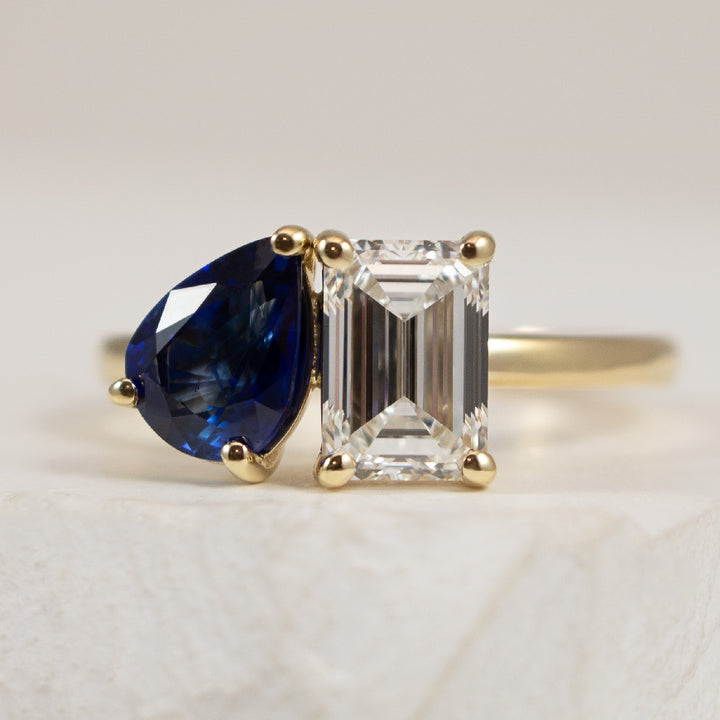 14KY Toi et Moi Sapphire & Diamond Ring        

14K Yellow Gold Toi et Moi Natural Sapphire & Lab Grown Diamond Ring 

Diamond - 1.35 Carat Emerald Cut Lab Grown Diamond of VS1 Clairty, E Colour, Excellent/ Excellent Cut, IGI Certified 

Sapph