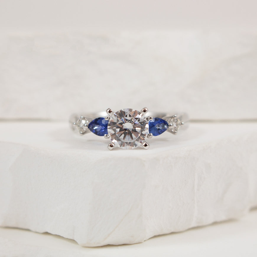 14KW 1.03CT Diamond & Sapphire Engagement Ring       

14K White Gold Gabriel & Co. Lab Grown, Natural Diamond & Sapphire Engagement Ring Setting 

Center: 1.03 Carat Lab Grown Round Brilliant Cut Diamond or VS1 Clarity, E Colour, Excellent/ Very