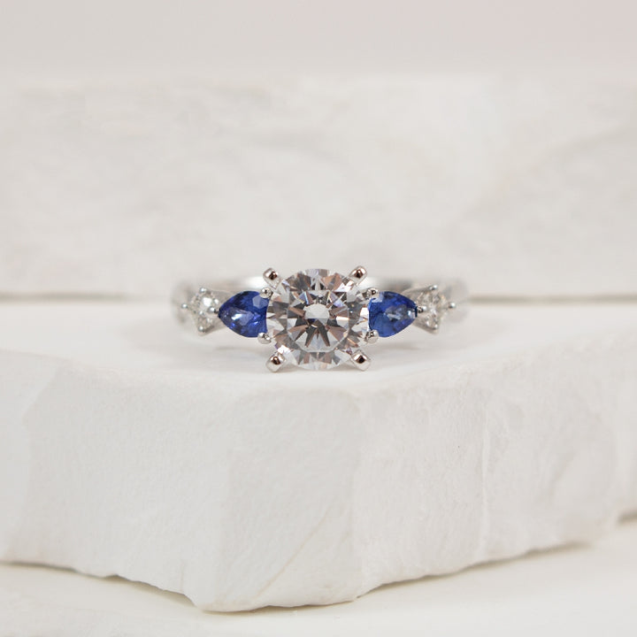 14KW 1.03CT Diamond & Sapphire Engagement Ring       

14K White Gold Gabriel & Co. Lab Grown, Natural Diamond & Sapphire Engagement Ring Setting 

Center: 1.03 Carat Lab Grown Round Brilliant Cut Diamond or VS1 Clarity, E Colour, Excellent/ Very