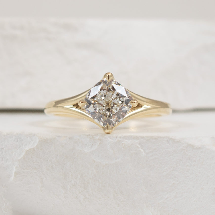 14KY East West Cushion Solitaire Engagement Ring   

14 Karat Yellow Gold Lab Grown Diamond East West Square Cushion Cut Split Shank Solitaire Engagement Ring 

Center - 1.50 Carat Cushion Cut Lab Grown Diamond of VS1 Clarity, F Colour, Excellent
