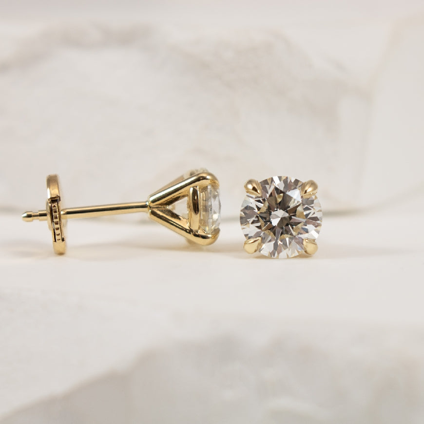 14KY 1.80 Carat Forevermark Diamond Solitaire Earrings 

14K Yellow Gold 1.80 Carat Forevermark Natural Diamond Solitaire Earrings with Positive Lock Backings 

1.80 Carat Round Brilliant Cut Forevermark Natural Diamond of VS2 Clarity, I-J Colour