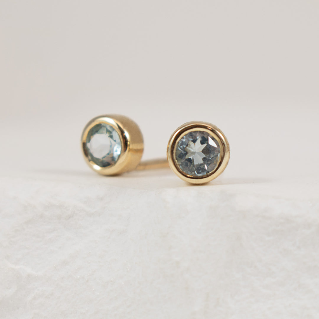 10KY Bezel Set Solitaire Blue Topaz Earrings