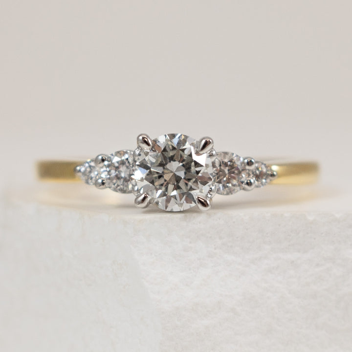 18KY/W Canadian Diamond Engagement Ring 

18K Yellow & White Gold Maple Leaf Canadian Diamond Engagement Ring 

Center - 0.50 Carat Round Brilliant Cut Natural Maple Leaf Canadian Diamond of SI2 Clarity, F Colour, Very Good Cut

Accent - 0.20TD