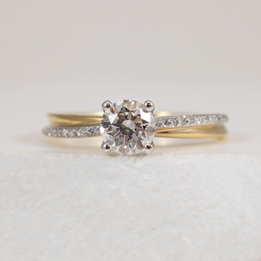 18KY/W Canadian Diamond 0.71 Carat Engagement Ring  

18K Yellow & White Gold Maple Leaf Canadian Natural Diamond Accented Engagement Ring 

Center  - 0.71 Carat Round Brilliant Cut Natural Maple Leaf Canadian Diamond of SI2 Clarity, G Colour, Ex